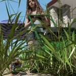 A young giantess is mowing her yard while a small person is trying to avoid doom.